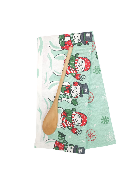 Christmas-themed towel with cartoon snowmen on a pale green snowy backgroundand