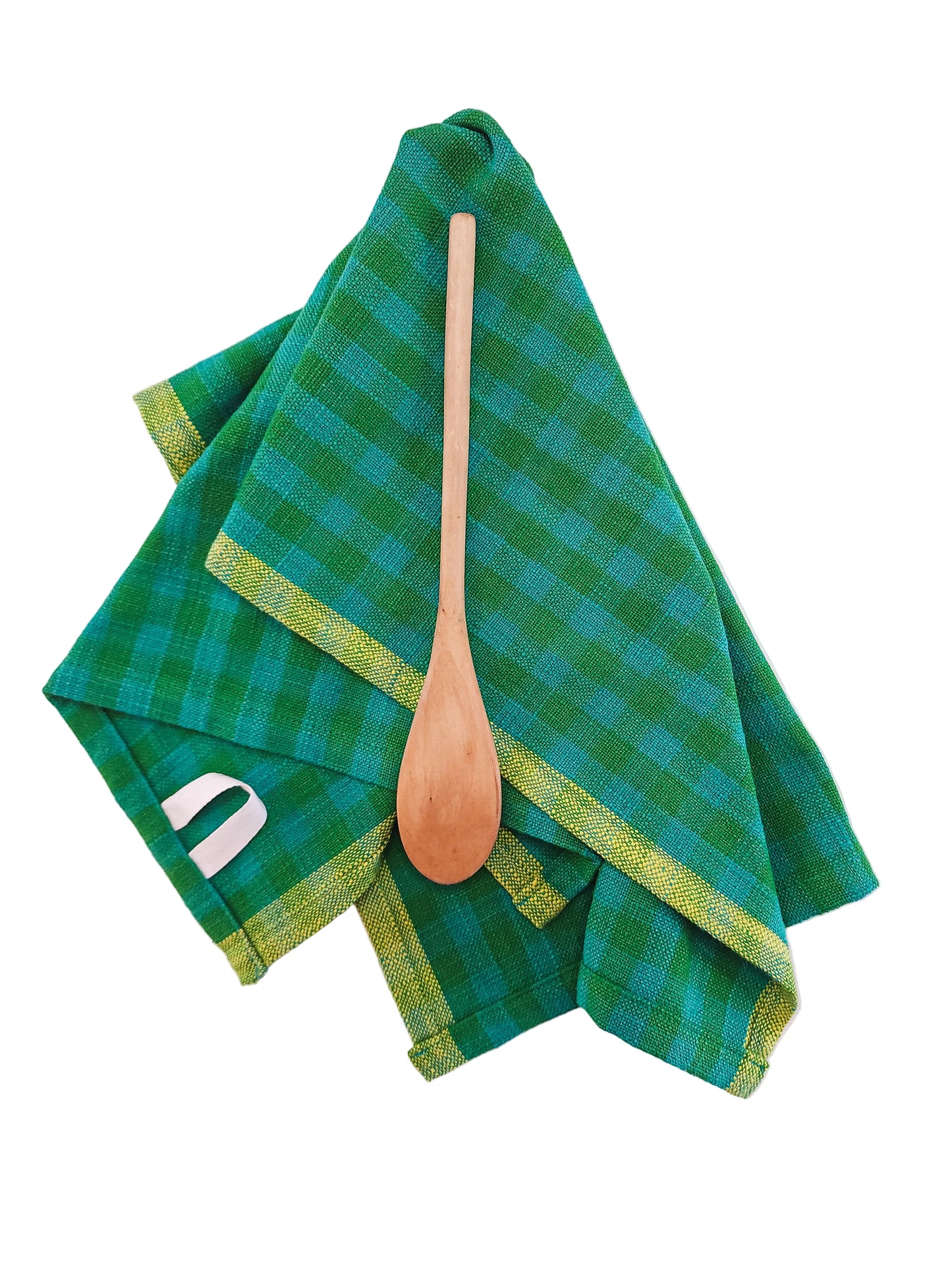 Green checkered towel with a wooden spoon on a white background