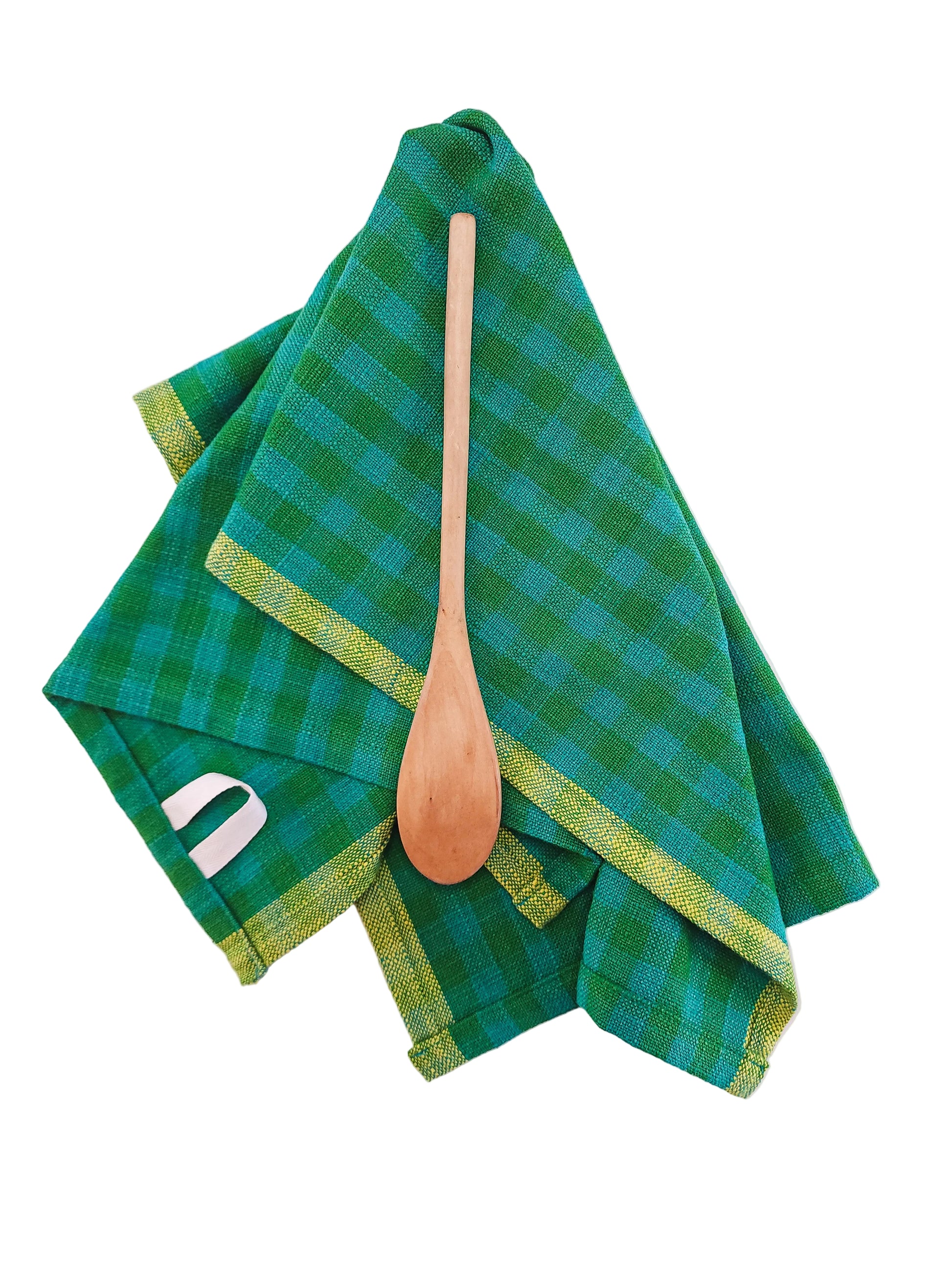 Green checkered towel with a wooden spoon on a white background